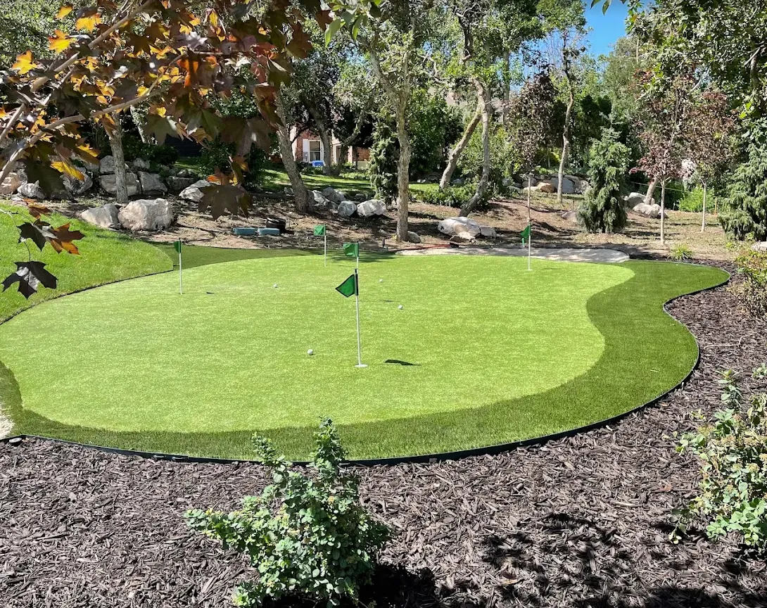 Backyard putting green with flags, fringe collar and steel edging
